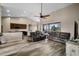 Open-concept living space with luxury flooring, vaulted ceilings, and seamless flow to the kitchen at 409 147Th Ne Ct, Bradenton, FL 34212