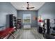 Well-lit home office with a ceiling fan, and modern wood-look flooring at 409 147Th Ne Ct, Bradenton, FL 34212