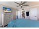 Spacious bedroom with large TV and ensuite bathroom access at 4485 Gulf Of Mexico Dr # 403, Longboat Key, FL 34228