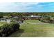 Aerial view of golf course, clubhouse, and driving range at 5122 Marsh Field Rd # 62, Sarasota, FL 34235