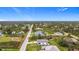 Aerial view of a residential neighborhood with a mix of houses and green spaces at 5339 Gulfport Ter, Port Charlotte, FL 33981