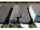 Aerial view of a single-Gathering home showcasing roof, landscaping, and surrounding neighborhood at 5719 Woodland Sage Dr, Sarasota, FL 34238