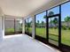 Spacious screened porch overlooking backyard at 5719 Woodland Sage Dr, Sarasota, FL 34238