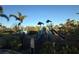 Community playground featuring a slide, climbing structures, and safety fencing at 5719 Woodland Sage Dr, Sarasota, FL 34238