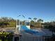 Community splash pad with slides, water features, and a safe, fun play area for  at 5719 Woodland Sage Dr, Sarasota, FL 34238
