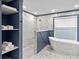 Spa-like bathroom with soaking tub and walk-in shower at 6817 Riverview Blvd, Bradenton, FL 34209