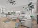 Open living space with large sectional sofa and views into kitchen at 6817 Riverview Blvd, Bradenton, FL 34209