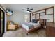 Main bedroom with a king-size bed and built-in shelving at 6817 Riverview Blvd, Bradenton, FL 34209