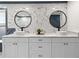 Bathroom featuring a double vanity and white cabinets at 6817 Riverview Blvd, Bradenton, FL 34209