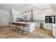 Modern kitchen with white cabinets, large island, and stainless steel appliances at 6817 Riverview Blvd, Bradenton, FL 34209