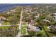 Aerial view of waterfront property showcasing a home with a pool and lush landscaping at 6817 Riverview Blvd, Bradenton, FL 34209
