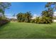 Expansive grassy backyard with lush landscaping at 6817 Riverview Blvd, Bradenton, FL 34209