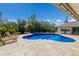 Inviting kidney-shaped pool with lounge chairs at 6817 Riverview Blvd, Bradenton, FL 34209