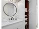 Bathroom with a vanity and built-in linen closet at 6817 Riverview Blvd, Bradenton, FL 34209
