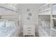 Bedroom with two bunk beds and coastal decor at 6817 Riverview Blvd, Bradenton, FL 34209