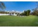 Large backyard with grassy lawn and patio at 6817 Riverview Blvd, Bradenton, FL 34209
