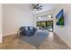 Spacious living room with sectional sofa and large TV at 6817 Riverview Blvd, Bradenton, FL 34209
