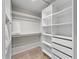 Spacious walk-in closet with shelving and hanging rods at 6817 Riverview Blvd, Bradenton, FL 34209