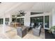 Spacious patio with seating area and outdoor TV at 6817 Riverview Blvd, Bradenton, FL 34209