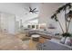 Open concept living room with a view of the kitchen and pool at 6817 Riverview Blvd, Bradenton, FL 34209