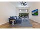 Spacious living room with sectional sofa and large TV at 6817 Riverview Blvd, Bradenton, FL 34209
