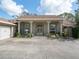 House with double doors and landscaping at 7317 Crape Myrtle Way, Sarasota, FL 34241