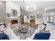 Bright living room with hardwood floors, a fireplace, and large windows at 7317 Crape Myrtle Way, Sarasota, FL 34241