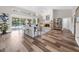 Spacious living room with fireplace and pool view at 7317 Crape Myrtle Way, Sarasota, FL 34241
