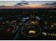 Night aerial view of home with pool and surrounding landscape lighting at 7317 Crape Myrtle Way, Sarasota, FL 34241