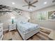 Bright bedroom with white furniture and nature wall art at 7317 Crape Myrtle Way, Sarasota, FL 34241