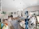 Open living area with high ceilings, hardwood floors, and stylish furnishings at 7317 Crape Myrtle Way, Sarasota, FL 34241