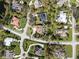 Neighborhood aerial view showcases the home's location, landscaping, and privacy at 7317 Crape Myrtle Way, Sarasota, FL 34241
