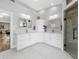 Spacious bathroom featuring white cabinetry, double sinks, and a walk-in shower at 7317 Crape Myrtle Way, Sarasota, FL 34241