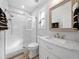 Modern bathroom with marble-look tile and a stylish vanity at 7317 Crape Myrtle Way, Sarasota, FL 34241