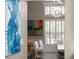 Bright dining room offers natural light from shuttered windows, modern artwork, and a contemporary light fixture at 7317 Crape Myrtle Way, Sarasota, FL 34241