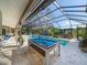 Enjoy a game of pool by the refreshing pool at 7317 Crape Myrtle Way, Sarasota, FL 34241