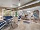 Bright patio with seating area and view into the living room at 7317 Crape Myrtle Way, Sarasota, FL 34241