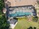Aerial view of a house with a large screened pool at 7317 Crape Myrtle Way, Sarasota, FL 34241