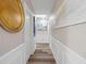 Bright hallway with wood flooring and wall art at 7317 Crape Myrtle Way, Sarasota, FL 34241