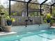 Screened pool with decorative fountain and landscaping at 7317 Crape Myrtle Way, Sarasota, FL 34241