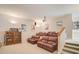 Spacious home theater with tiered seating and projector at 854 Macewen Dr, Osprey, FL 34229