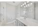 Clean bathroom with a grey vanity and a bathtub at 854 Macewen Dr, Osprey, FL 34229