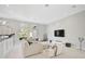 Bright living room with sectional sofa and large TV at 854 Macewen Dr, Osprey, FL 34229