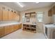 Bright laundry room with ample cabinetry and countertop space at 854 Macewen Dr, Osprey, FL 34229