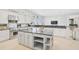 Spacious kitchen with island, granite, and stainless steel appliances at 854 Macewen Dr, Osprey, FL 34229