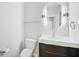 Modern powder room with floating vanity and oval mirror at 854 Macewen Dr, Osprey, FL 34229