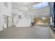Open living area with high ceilings, modern staircase, and pool access at 854 Macewen Dr, Osprey, FL 34229