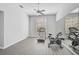 Home gym with treadmill, exercise bike, and mirrored wall at 854 Macewen Dr, Osprey, FL 34229