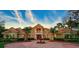 Grand two-story home with circular drive and fountain at 854 Macewen Dr, Osprey, FL 34229