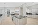 Modern kitchen with center island and granite countertops at 854 Macewen Dr, Osprey, FL 34229